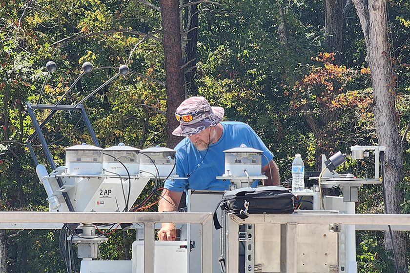 James Martin, an ARM calibration technician who is typically based at the Southern Great Plains (SGP) atmospheric observatory in Oklahoma, works to align the sky radiation collection of radiometers (left) at the BNF’s main site in late August. Martin and others also helped prepare BNF instruments and containers at the SGP before their deployment to Alabama. 